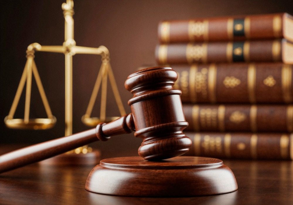 Gavel, scales of justice and a stack of law books
